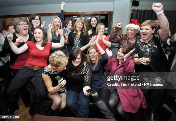 Choir member Emma Hanlon-Penny with members of the Military Wives Choir at RMB Chivenor in Devon takes a phone call from Decca Records confirming...