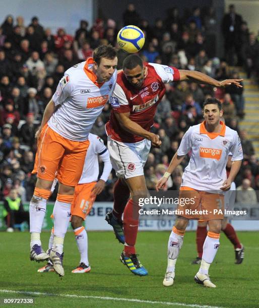 Fleetwood Town's Nathan Pond battles for the ball with Blackpool's Danny Wilson during the FA Cup, Third Round match at Highbury Stadium, Fleetwood.