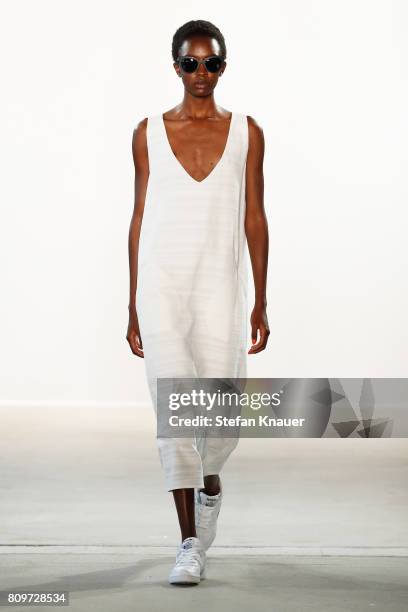 Model walks the runway at the Hien Le show during the Mercedes-Benz Fashion Week Berlin Spring/Summer 2018 at Kaufhaus Jandorf on July 6, 2017 in...