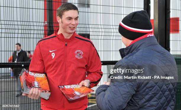 Fleetwood Town's Richard Brodie sells programes outside the teams Highbury Stadium, the striker is suspended for today's FA Cup Third round match...