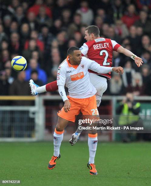 Fleetwood Town's Shaun Beeley battles for the ball with Blackpool's Matt Phillips during the FA Cup, Third Round match at Highbury Stadium, Fleetwood.