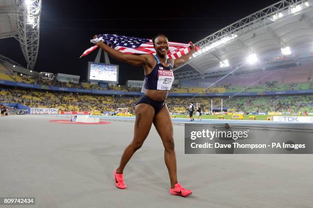 S Carmelita Jeter celebrates winning the Women's 100m Final