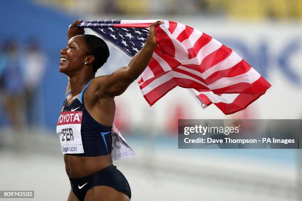 S Carmelita Jeter celebrates winning the Women's 100m Final