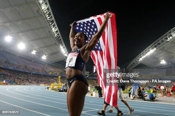 S Carmelita Jeter celebrates winning the Women's 100m Final