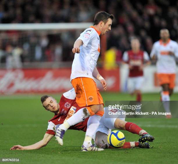 Fleetwood Town's Jamie Vardy battles for the ball with Blackpool's Danny Wilson during the FA Cup, Third Round match at Highbury Stadium, Fleetwood.