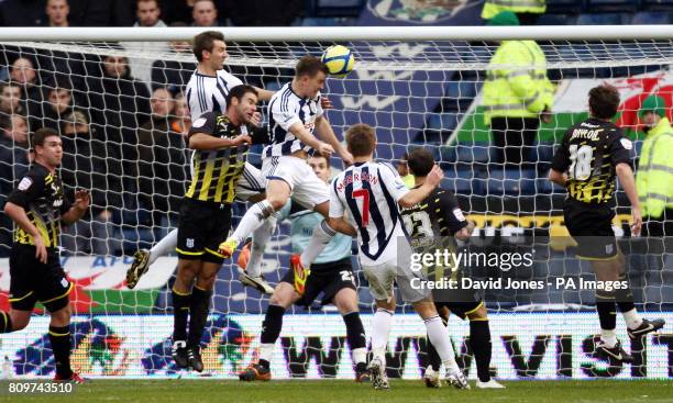 West Bromwich Albion's Simon Cox heads his sides second goal during the FA Cup, Third Round match at The Hawthorns, West Bromwich.