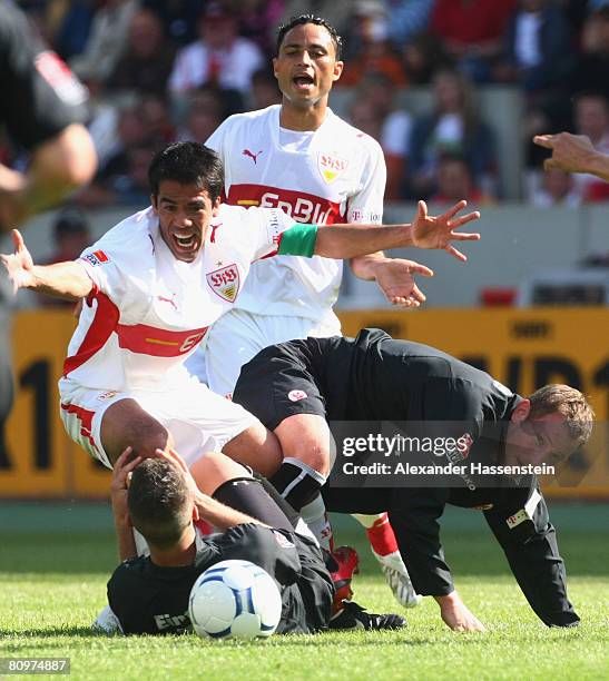 Pavel Padro of Stuttgart battles for the ball with Benjamin Koehler of Frankfurt and his team mate Michael Fink , whilst Antonio da Silva of...