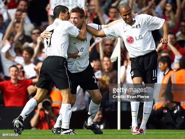 Brian McBride of Fulham celebrates with his team mates after he scored the first goal during the Barclays Premier League match between Fulham and...