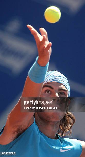 Spanish Rafael Nadal prepares to serve the ball to his German opponent Dennis Gremelmayr during their semifinals match in the Barcelona Open tennis...