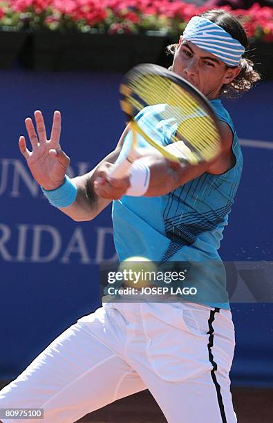 Spanish Rafael Nadal returns the ball to his German opponent Dennis Gremelmayr during their semifinals match in the Barcelona Open tennis tournament...