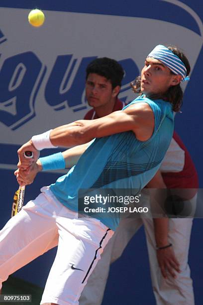 Spanish Rafael Nadal returns the ball to his German opponent Dennis Gremelmayr during their semifinals match in the Barcelona Open tennis tournament...