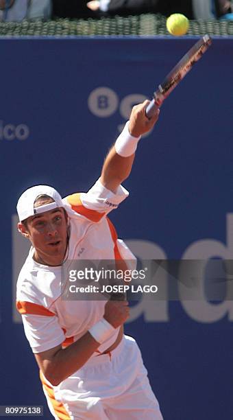 German Dennis Gremelmayr prepares to serve the ball to his Spanish opponent Rafael Nadal during their semifinals match in the Barcelona Open tennis...