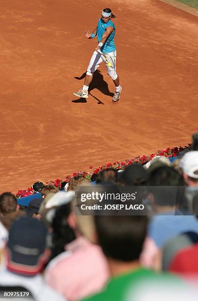 Spanish Rafael Nadal returns the ball to his German opponent Dennis Gremelmayr during their semifinals match in the Barcelona Open tennis tournament...