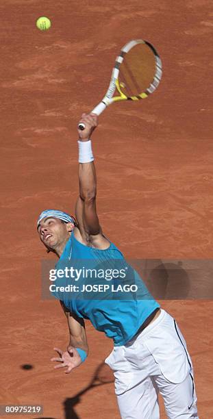 Spanish Rafael Nadal returns the ball to his German opponent Dennis Gremelmayr during their semifinals match in the Barcelona Open tennis tournament...