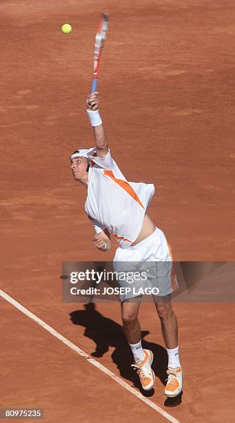 German Dennis Gremelmayr prepares to serve to his Spanish opponent Rafael Nadal during their semifinals match in the Barcelona Open tennis tournament...