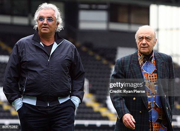 Fulham Chairman Mohamed Al Fayed walks next to QPR's co owner and Renault F1 team boss Flavio Briatore after they won the Barclays Premier League...