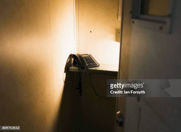 The telephone with which crew members called home is seen inside a booth on the decommissioned Brent Delta Topside oil platform at the Able UK site...