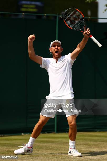 Dudi Sela of Israel celebrates match point and victory during the Gentlemen's Singles second round match aganst John Isner of The United States on...