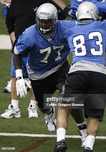 Gosder Cherilus of the Detroit Lions does a drill behind Jawad Nesheiwat during rookie training camp at the Detroit Lions Headquarters and Training...