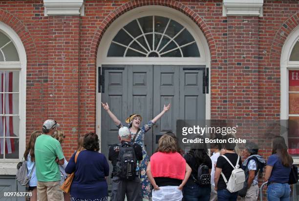 Tour guide in period costume leads a Freedom Trail tour group at Faneuil Hall in Boston on Jun. 29, 2017.