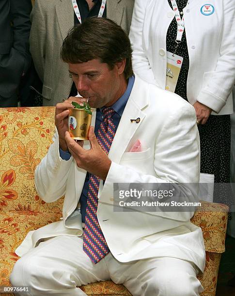 Paul Azinger, 2008 U.S. Ryder captain takes a drink from a $1,000 Mint Julep Cup which he received from Penny Chenery, Secretariat's owner and...