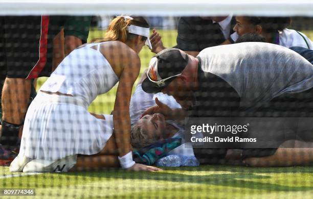 Bethanie Mattek-Sands of The United States receives treatment from the medical team and later retires from the Ladies Singles second round match...