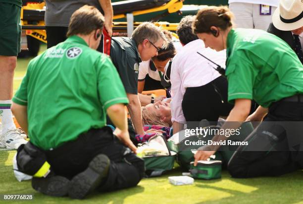 Bethanie Mattek-Sands of The United States receives treatment from the medical team and later retires from the Ladies Singles second round match...