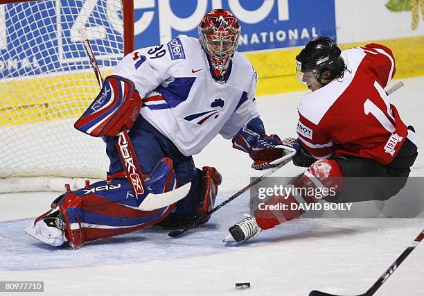 Roman Wick of Switzerland misses a scoring chance on Cristobal Huet of France in the first period during the preliminary round at the 2008 IIHF World...