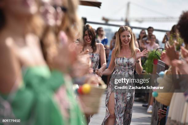 Designers Gelena Roizen and Lana Mueller acknowledge the applause of the audience the Lana Mueller show during the Mercedes-Benz Fashion Week Berlin...