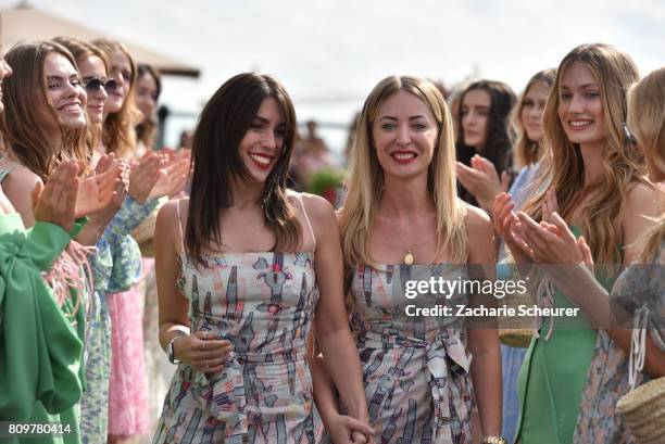 Designers Gelena Roizen and Lana Mueller acknowledge the applause of the audience the Lana Mueller show during the Mercedes-Benz Fashion Week Berlin...