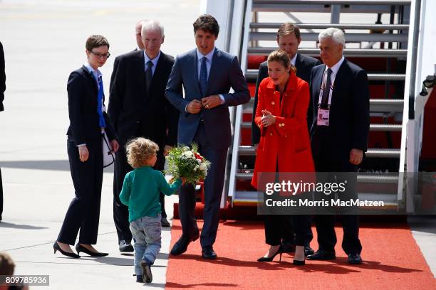 Prime Minister of Canada Justin Trudeau with first lady Sophie Trudeau and their youngest son Hadrien arrive at Hamburg Airport for the Hamburg G20...