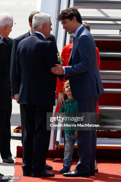 Prime Minister of Canada Justin Trudeau with first lady Sophie Trudeau and their youngest son Hadrien arrive at Hamburg Airport for the Hamburg G20...