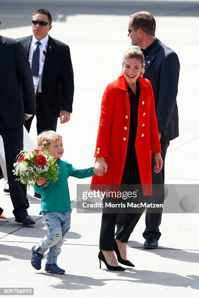 First lady of Canada Sophie Trudeau and her youngest son Hadrien Trudeau arrive at Hamburg Airport for the Hamburg G20 economic summit on July 6,...