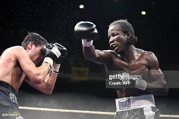 Ukraine's Viktor Plotnikov and Belgian Sugar Jackson Osei Bonsu fight during the boxing match 'The Night of the Fight III', on May 3, 2008 in...