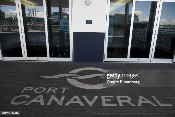 Port Canaveral signage is displayed on a mat at the entrance of a cruise terminal in Cape Canaveral, Florida, U.S., on Wednesday, July 5, 2017. The...