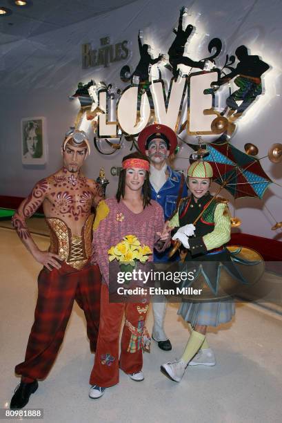 "The Beatles LOVE by Cirque du Soleil" show cast members Hassan El Hajjami, Ryan Dawes, Craig Berman and Leisha Knight, pose as they wait for...