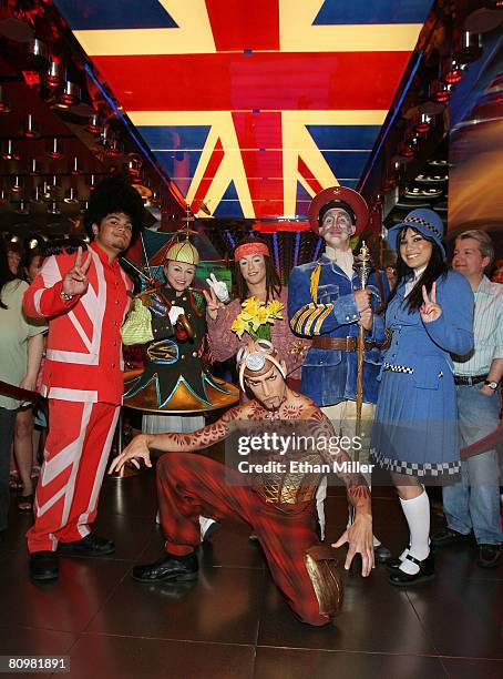 "The Beatles LOVE by Cirque du Soleil" show ushers stand on either side of cast members Leisha Knight, Ryan Dawes and Craig Berman, with Hassan El...