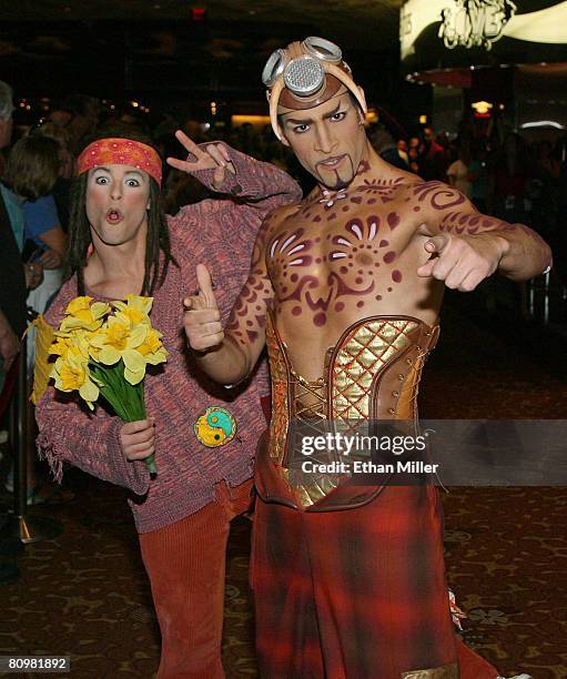 "The Beatles LOVE by Cirque du Soleil" show cast members Ryan Dawes and Hassan El Hajjami pose while waiting for "American Idol" contestants to...