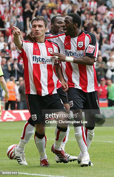 Marek Saganowski of Southampton is congratulated by Jason Euell after he scores their first goal during the Coca-Cola Championship match between...