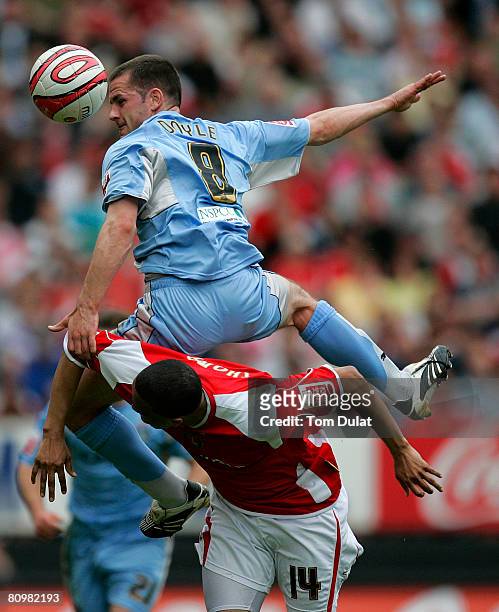 Jerome Thomas of Charlton Athletic battles for the ball with Michael Doyle of Coventry City during the Coca Cola Championship match between Charlton...
