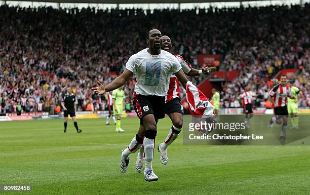 Stern John of Southampton celebrates scoring their second goal with Jason Euell during the Coca-Cola Championship match between Southampton and...