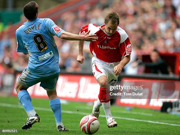 Michael Doyle of Coventry City fails to stop Luke Varney of Charlton Athletic during the Coca Cola Championship match between Charlton Athletic and...