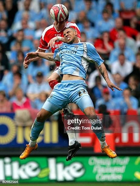 Grant Basey of Charlton Athletic and Leon Best of Coventry City contest a header during the Coca Cola Championship match between Charlton Athletic...