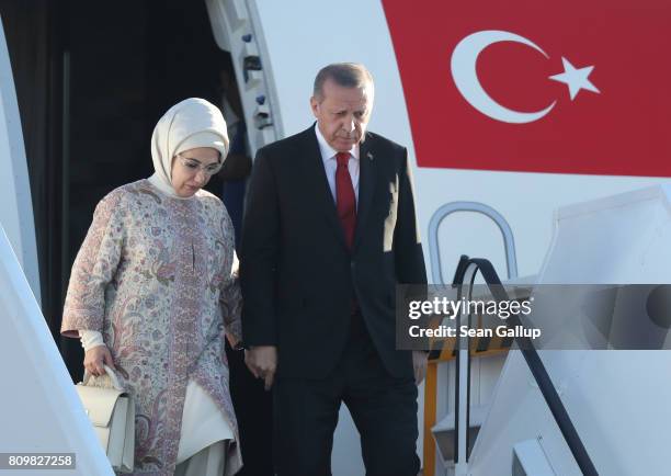 Turkish President Recep Tayyip Erdogan and his wife Emine arrive at Hamburg Airport for the Hamburg G20 economic summit on July 6, 2017 in Hamburg,...