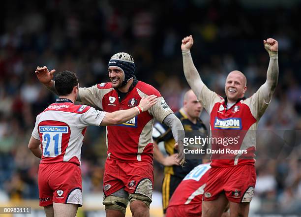 Gareth Cooper , Marco Bortolami and Nick Wood celebrate after victory during the Guinness Premiership match between London Wasps and Gloucester at...