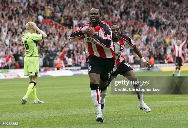 Stern John of Southampton celebrates scoring their second goal with Jason Euell during the Coca-Cola Championship match between Southampton and...