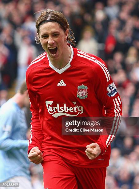 Fernando Torres of Liverpool celebrates scoring the opening goal during the Barclays Premier League match between Liverpool and Manchester City at...