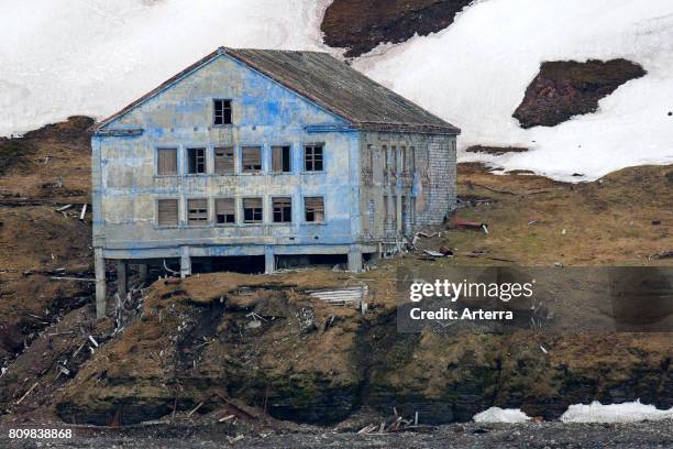 Dilapidated building of deserted Russian mining settlement in Svalbard, between Longyearbyen and Barentsburg, Isfjorden, Spitsbergen, Norway.