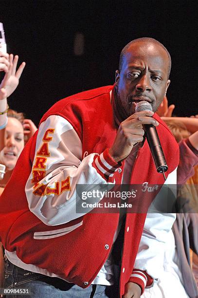 Wyclef Jean performs with audience members at the mtvU's Campus Invasion Music Tour 08' at Penn's Landing May 3, 2008 in Philadelphia, Pennsylvania.