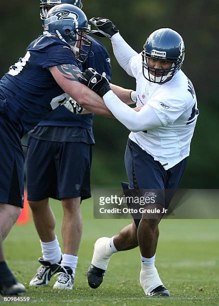 Linebacker Wesly Mallard of the Seattle Seahawks battles Mike Wahle during mini camp on May 4, 2008 at Seahawks Headquarters in Kirkland, Washington.